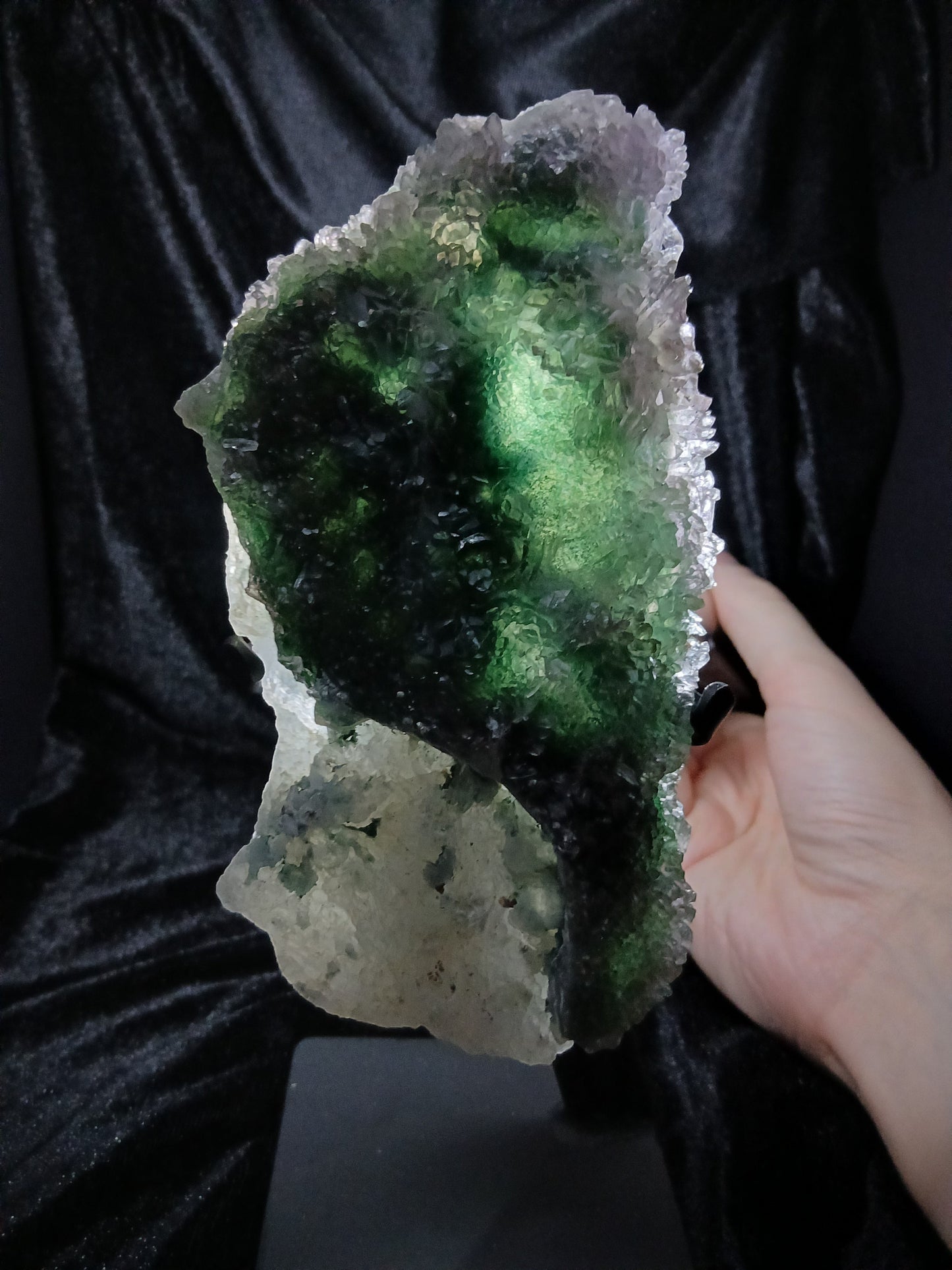 Fordite Haus: Crystals & Fordite green chalcedony and lavender amethyst flower crystal specimen on a display stand.