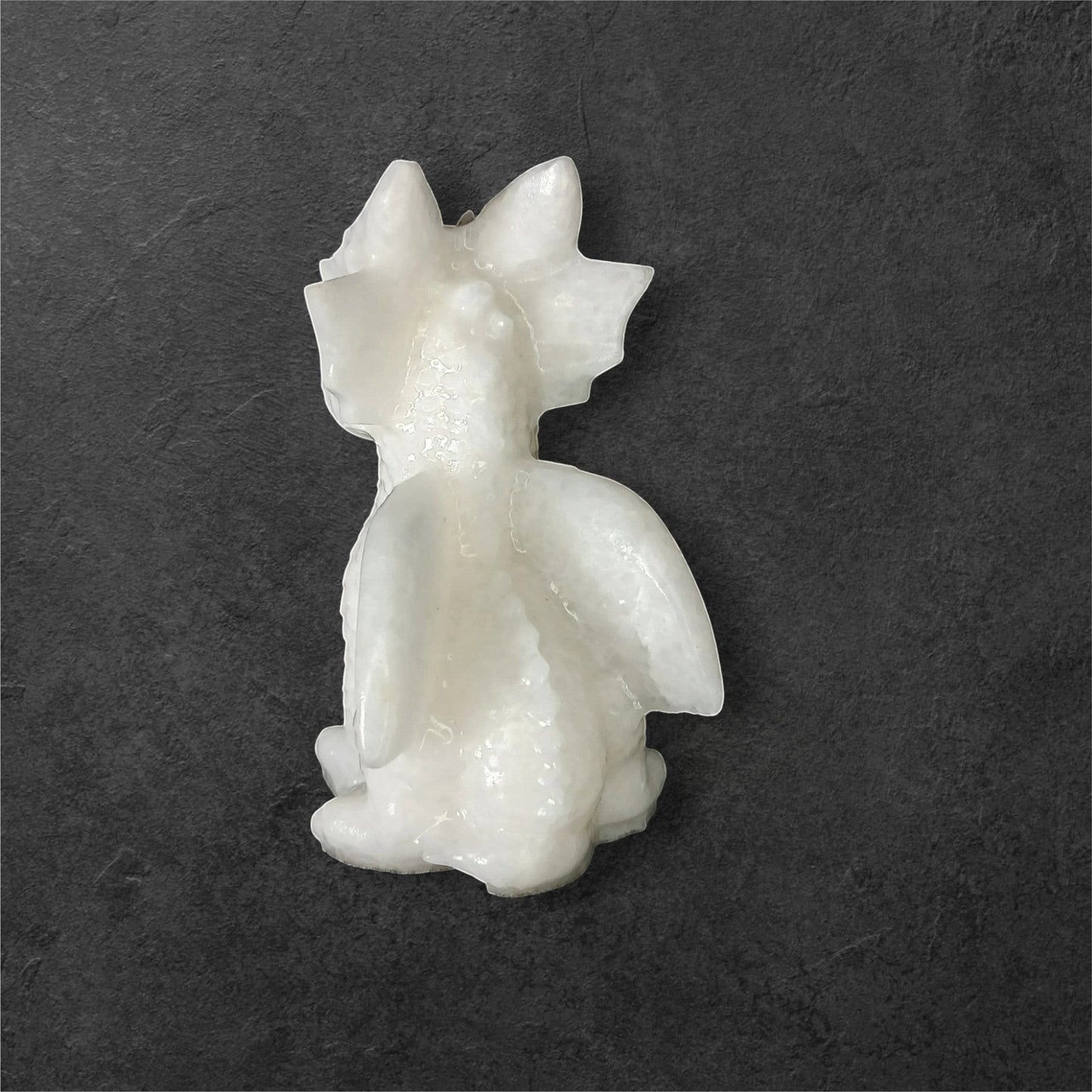 Fordite Haus: Crystals & Fordite 3.25-inch white jade dragon carving with smooth, polished natural stone finish.