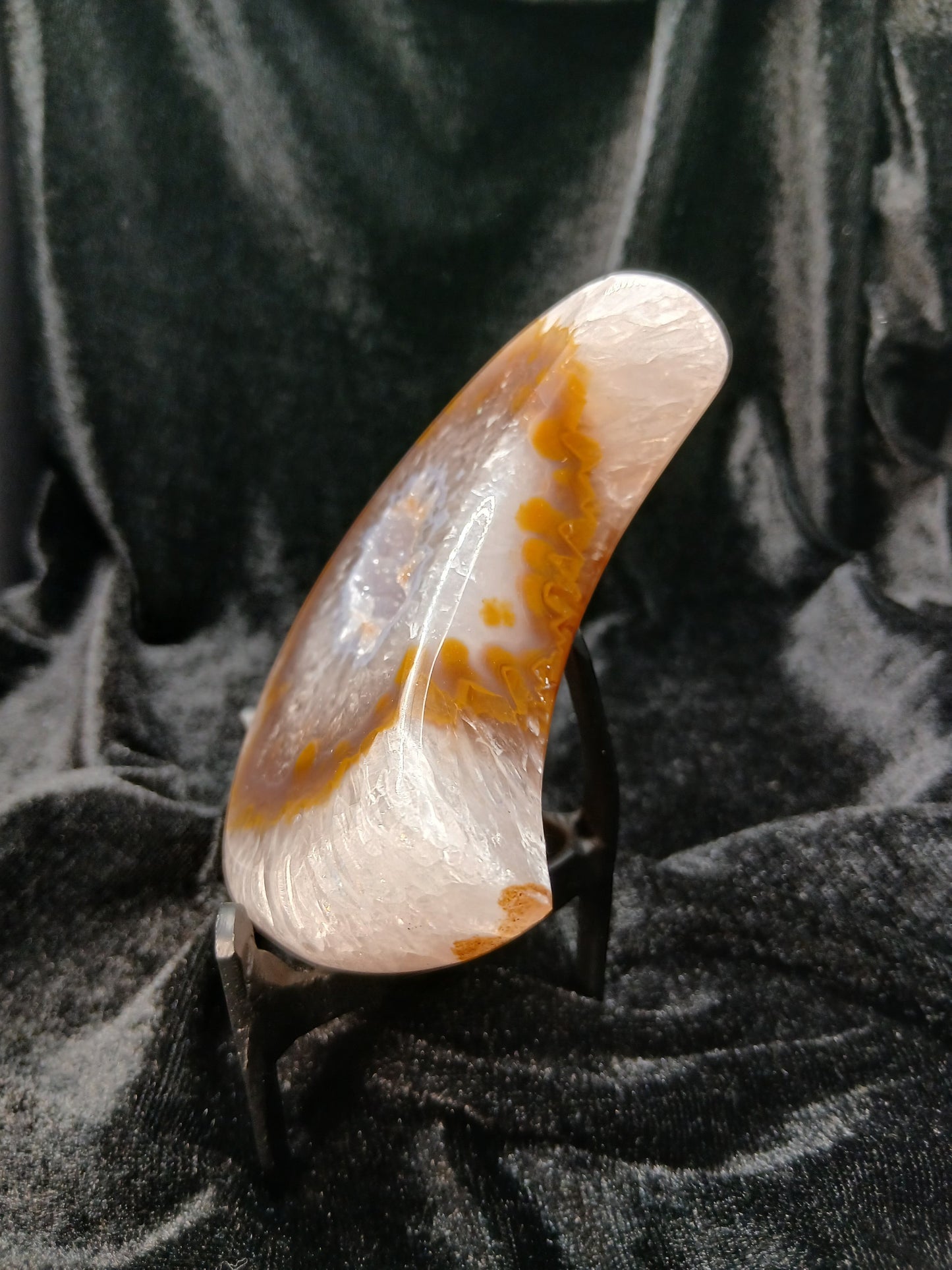 Fordite Haus: Crystals & Fordite 3.9in crescent moon carving made of translucent agate with brown inclusions on stand