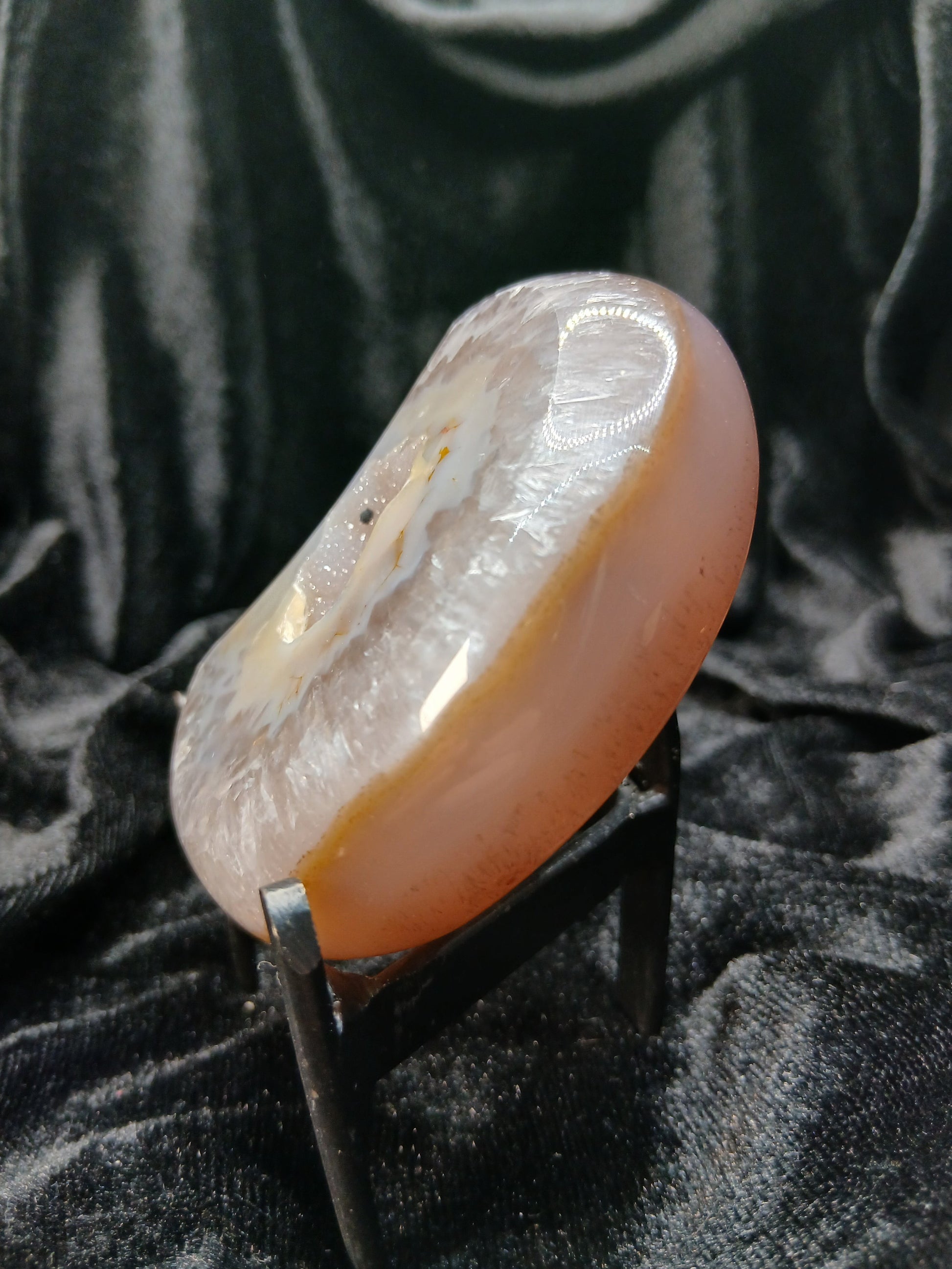 Fordite Haus: Crystals & Fordite Brazilian agate moon carving in taupe and white with a central druzy geode on a stand
