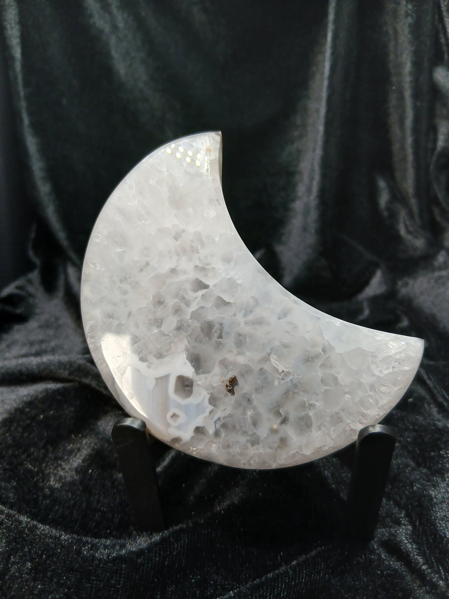 Fordite Haus: Crystals & Fordite 3.8-inch crescent moon carving made of translucent white and grey Brazilian agate.