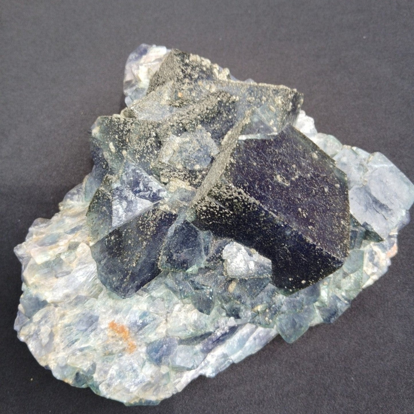 Fordite Haus: Crystals & Fordite cubic green fluorite mineral specimen from Nigeria with pyrite dusting.