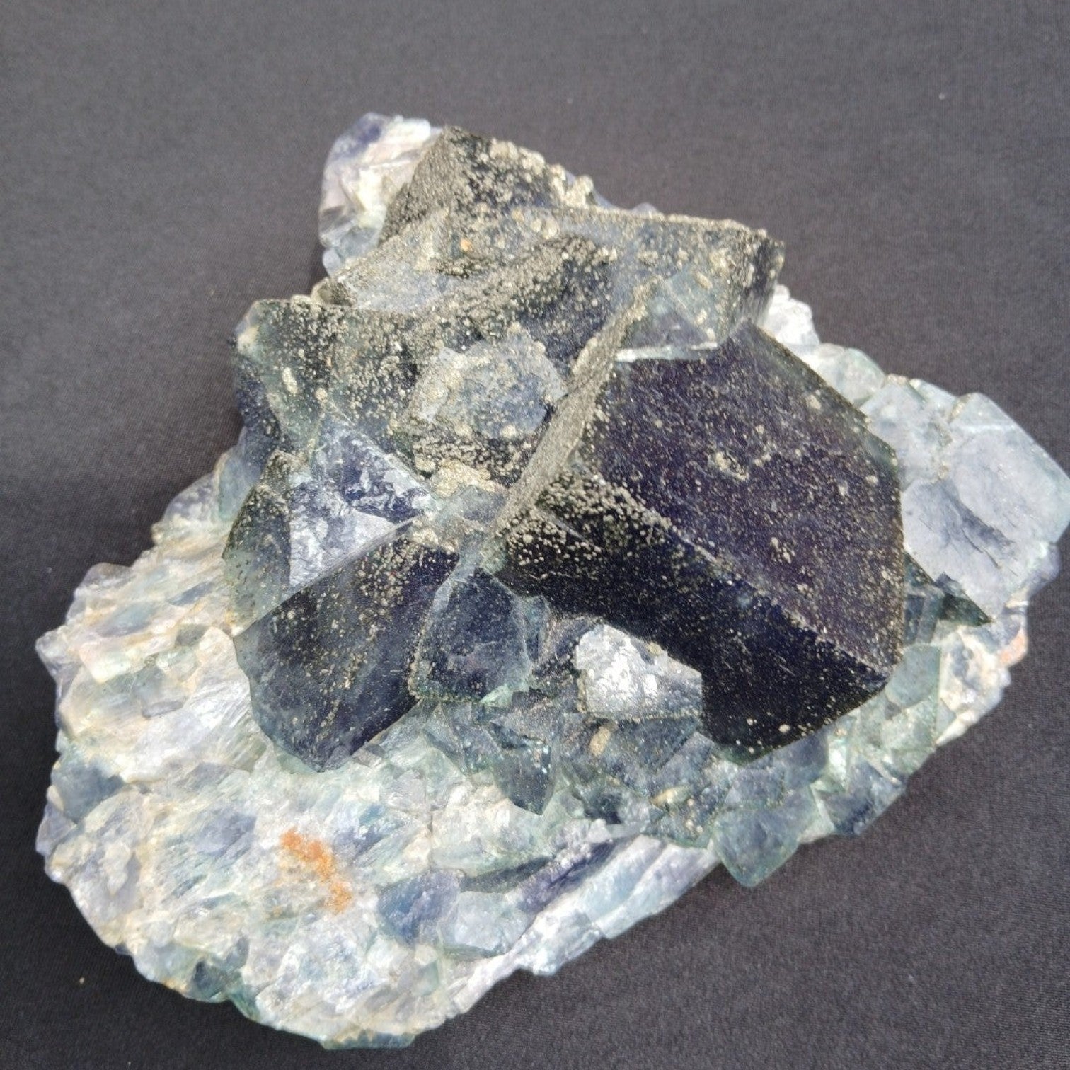 Fordite Haus: Crystals & Fordite cubic green fluorite mineral specimen from Nigeria with pyrite dusting.