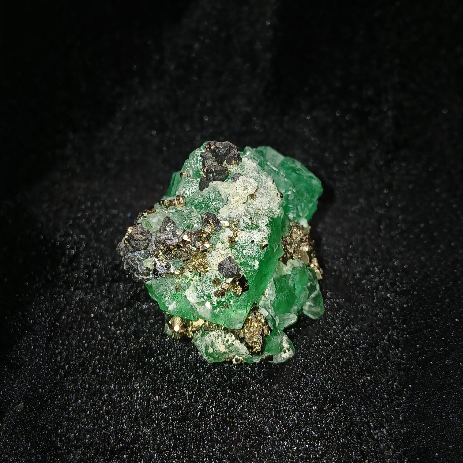 Fordite Haus: Crystals & Fordite green fluorite mineral specimen with metallic pyrite and sphalerite inclusions