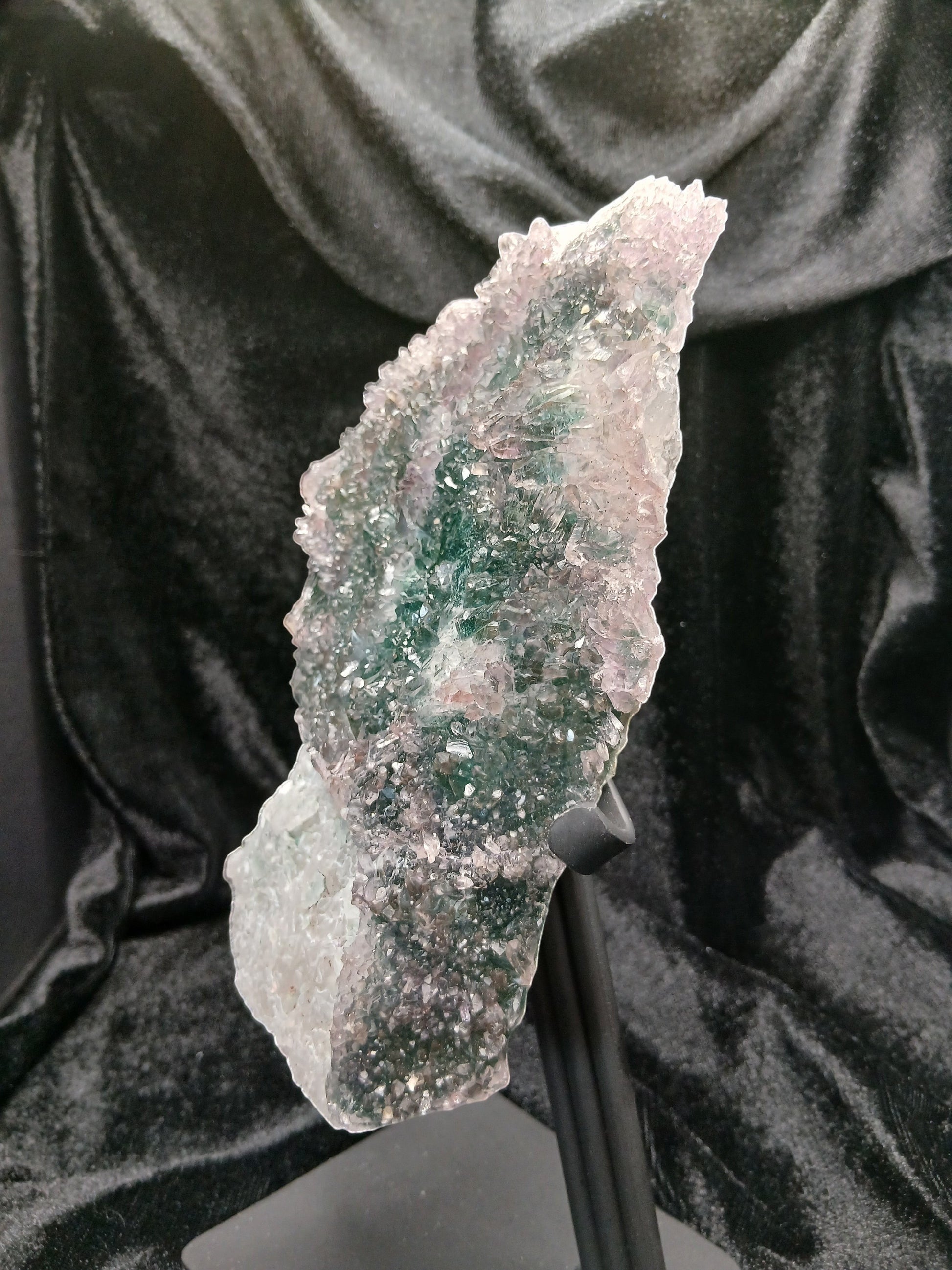 Fordite Haus: Crystals & Fordite green chalcedony and lavender amethyst flower crystal specimen on a black metal stand