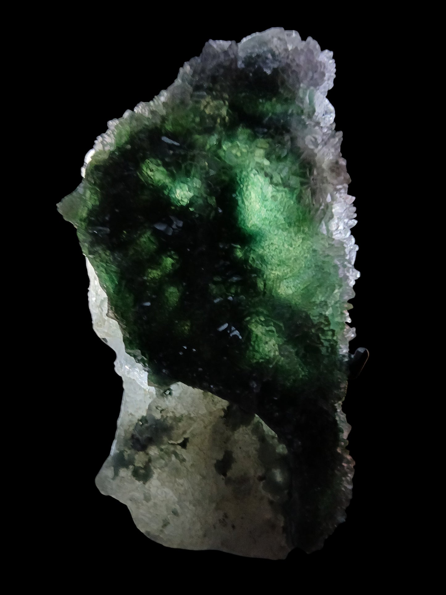 Fordite Haus: Crystals & Fordite green chalcedony and lavender amethyst flower mineral specimen glowing on black background