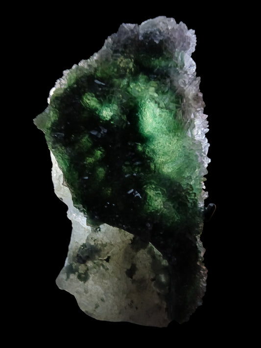 Fordite Haus: Crystals & Fordite green chalcedony and lavender amethyst flower mineral specimen glowing on black background