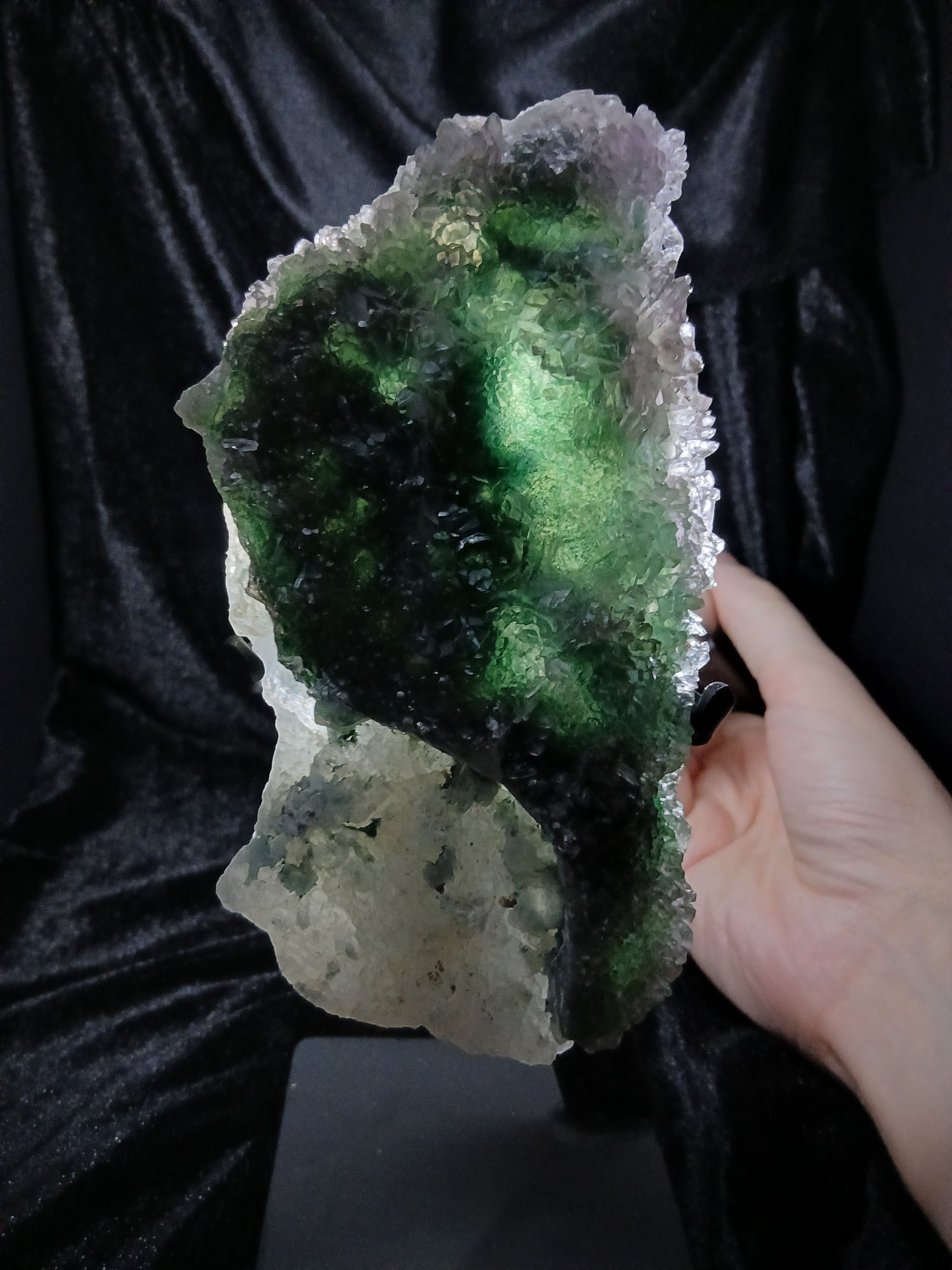 Fordite Haus: Crystals & Fordite green chalcedony and lavender amethyst flower crystal specimen on a display stand.