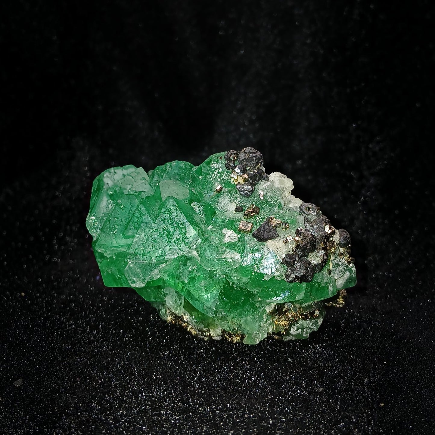 Fordite Haus: Crystals & Fordite green fluorite mineral specimen with pyrite and sphalerite inclusions from Peru.