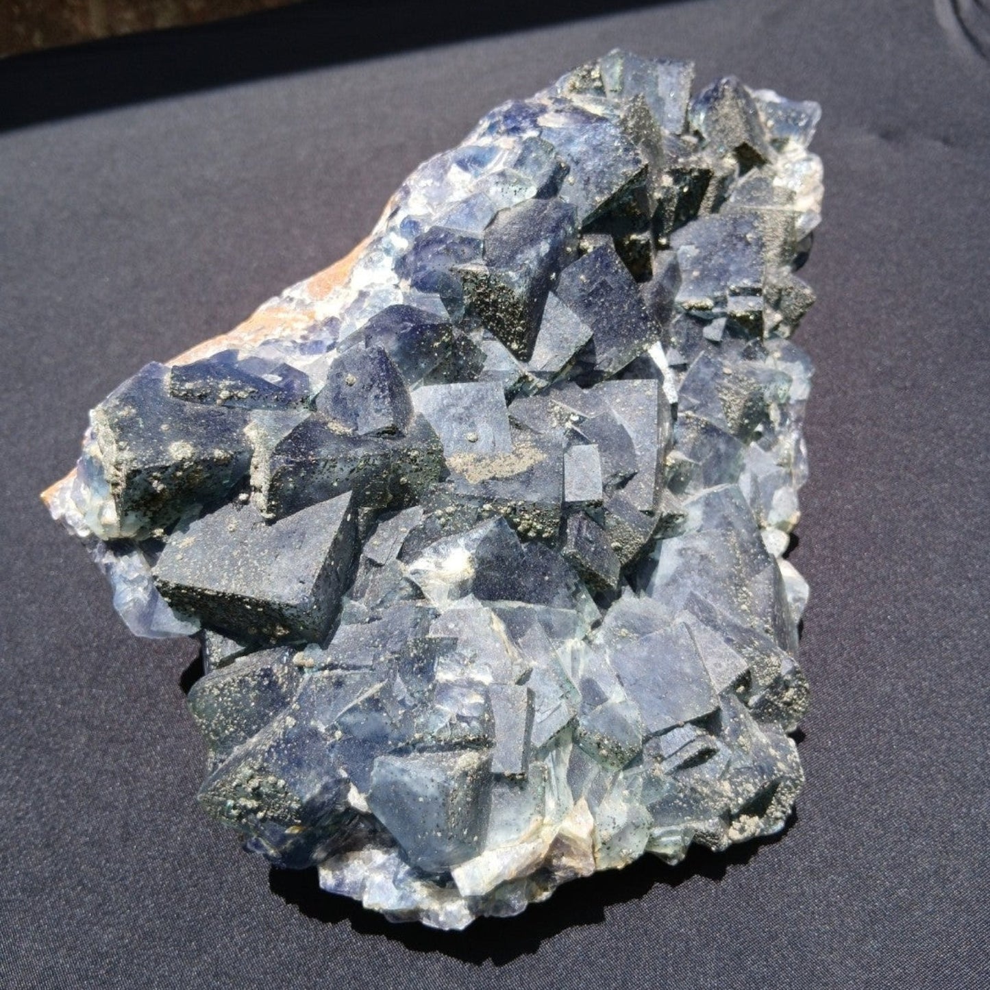 Fordite Haus: Crystals & Fordite large green fluorite mineral specimen from Nigeria with pyrite dusting.