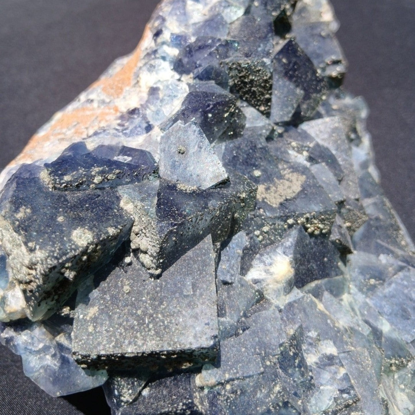 Fordite Haus: Crystals & Fordite green Superior Mine fluorite mineral specimen with pyrite dusting and crystal facets.