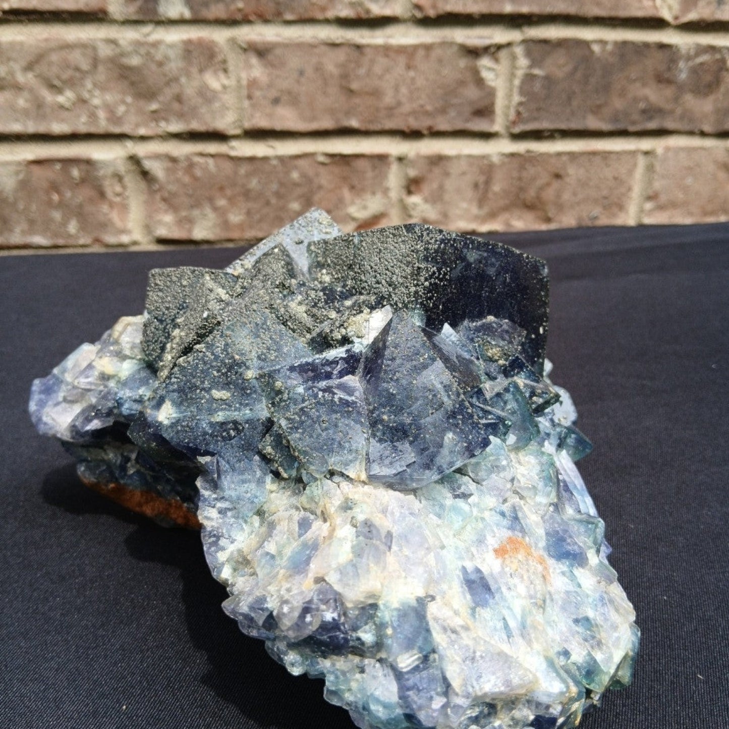 Fordite Haus: Crystals & Fordite green cubic fluorite mineral specimen with pyrite dusting from Superior Mine.