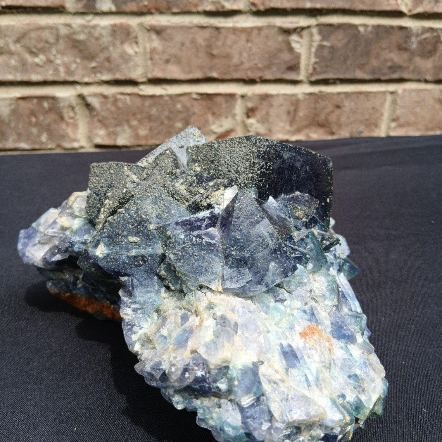 Fordite Haus: Crystals & Fordite green cubic fluorite mineral specimen with pyrite dusting from Superior Mine.