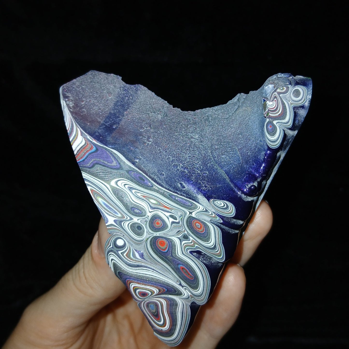 Fordite Haus: Crystals & Fordite 52g Jeepite slab with vibrant multi-colored paint layers and swirls on black background