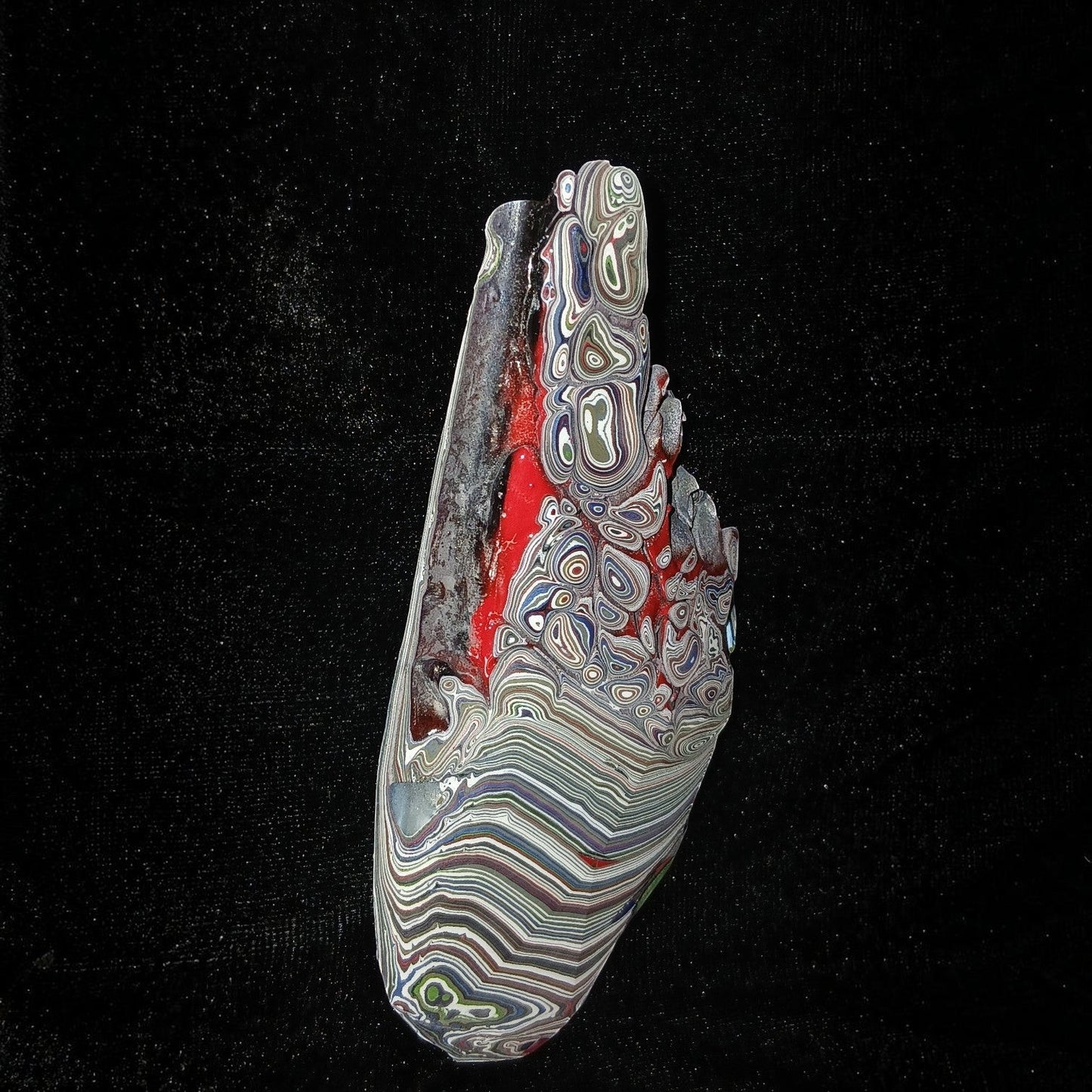 Fordite Haus: Crystals & Fordite 84g Jeepite slab with vibrant multi-colored paint layers and swirls on black background