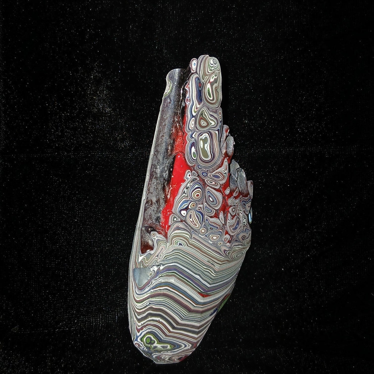 Fordite Haus: Crystals & Fordite 84g Jeepite slab with vibrant multi-colored paint layers and swirls on black background