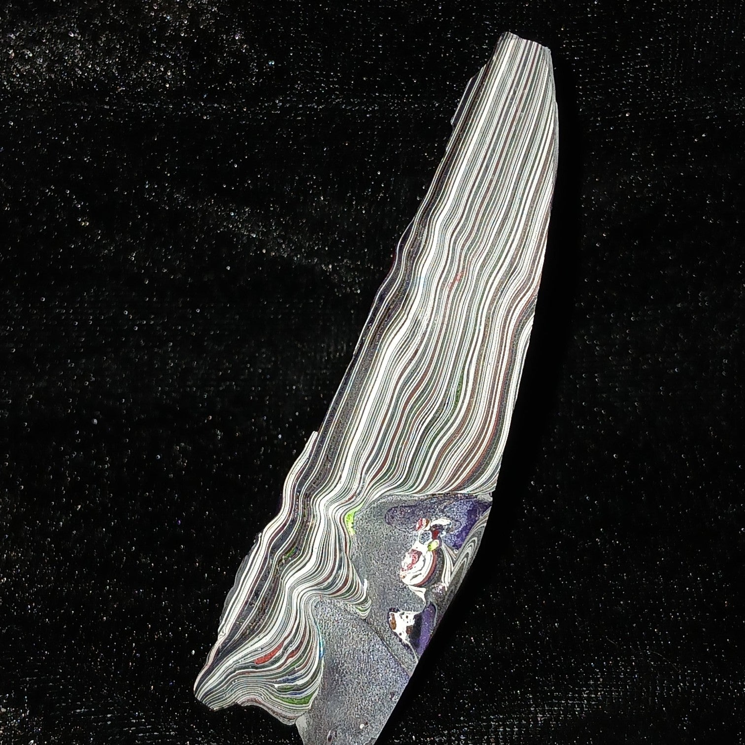 Fordite Haus: Crystals & Fordite 52g Jeepite specimen with intricate multi-colored paint layers on black background