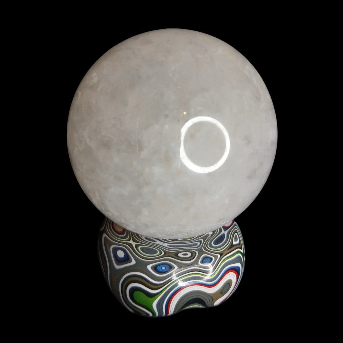 Fordite Haus: Crystals & Fordite Jeepite sphere stand featuring colorful layered automotive paint patterns