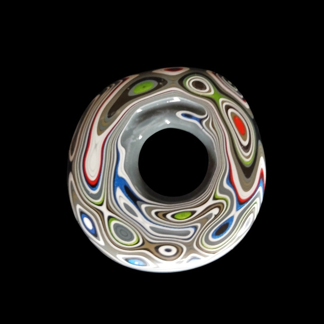 Fordite Haus: Crystals & Fordite Jeepite sphere stand featuring colorful layered automotive paint in a ring shape