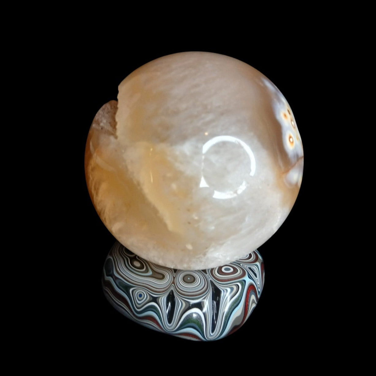 Fordite Haus: Crystals & Fordite mini sphere stand featuring colorful layered automotive paint patterns