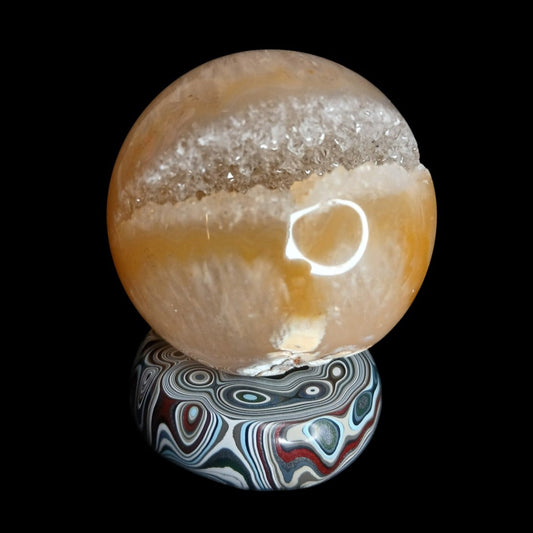 Fordite Haus: Crystals & Fordite hand-polished automotive paint mini sphere stand with colorful layered patterns