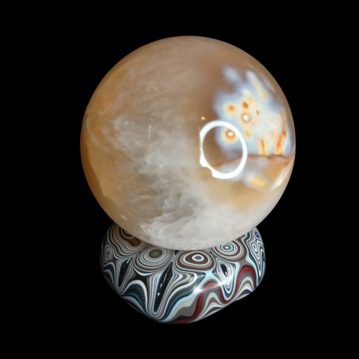 Fordite Haus: Crystals & Fordite hand-polished automotive paint mini sphere stand with colorful enamel layers.