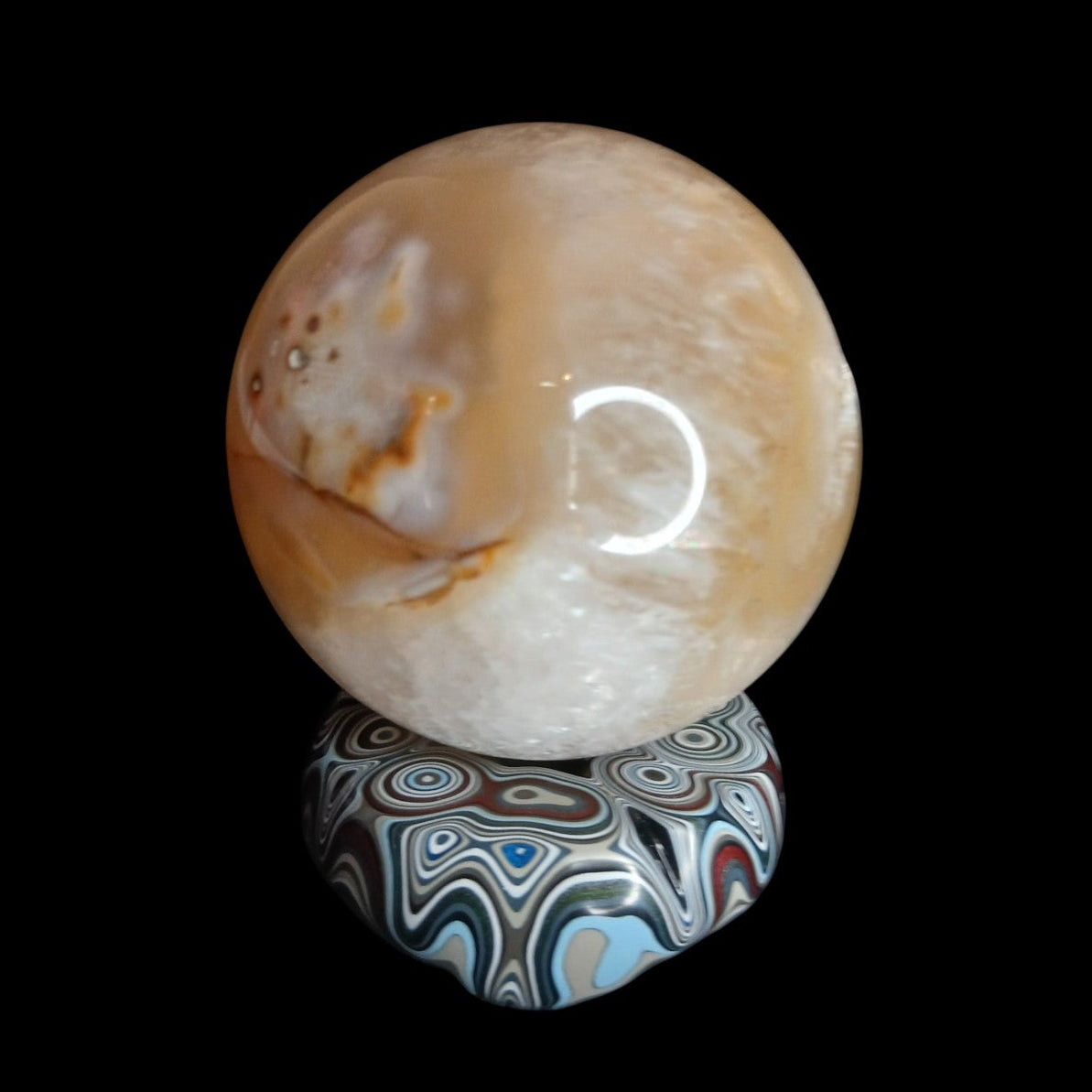 Fordite Haus: Crystals & Fordite hand-polished automotive paint mini sphere stand with colorful layered enamel patterns