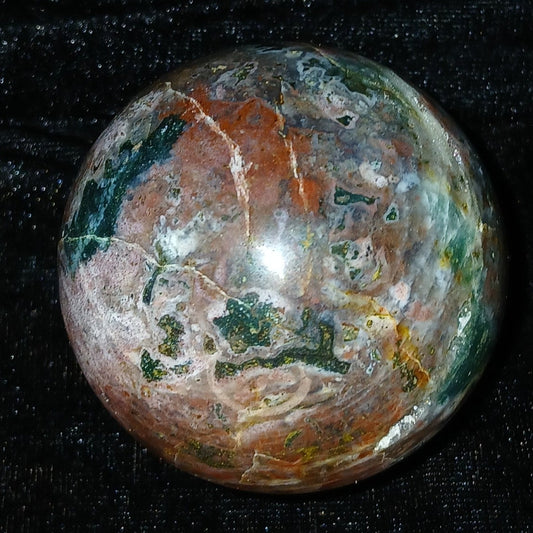 Fordite Haus: Crystals & Fordite 61mm Ocean Jasper sphere from Madagascar with green, red, and brown orbicular patterns