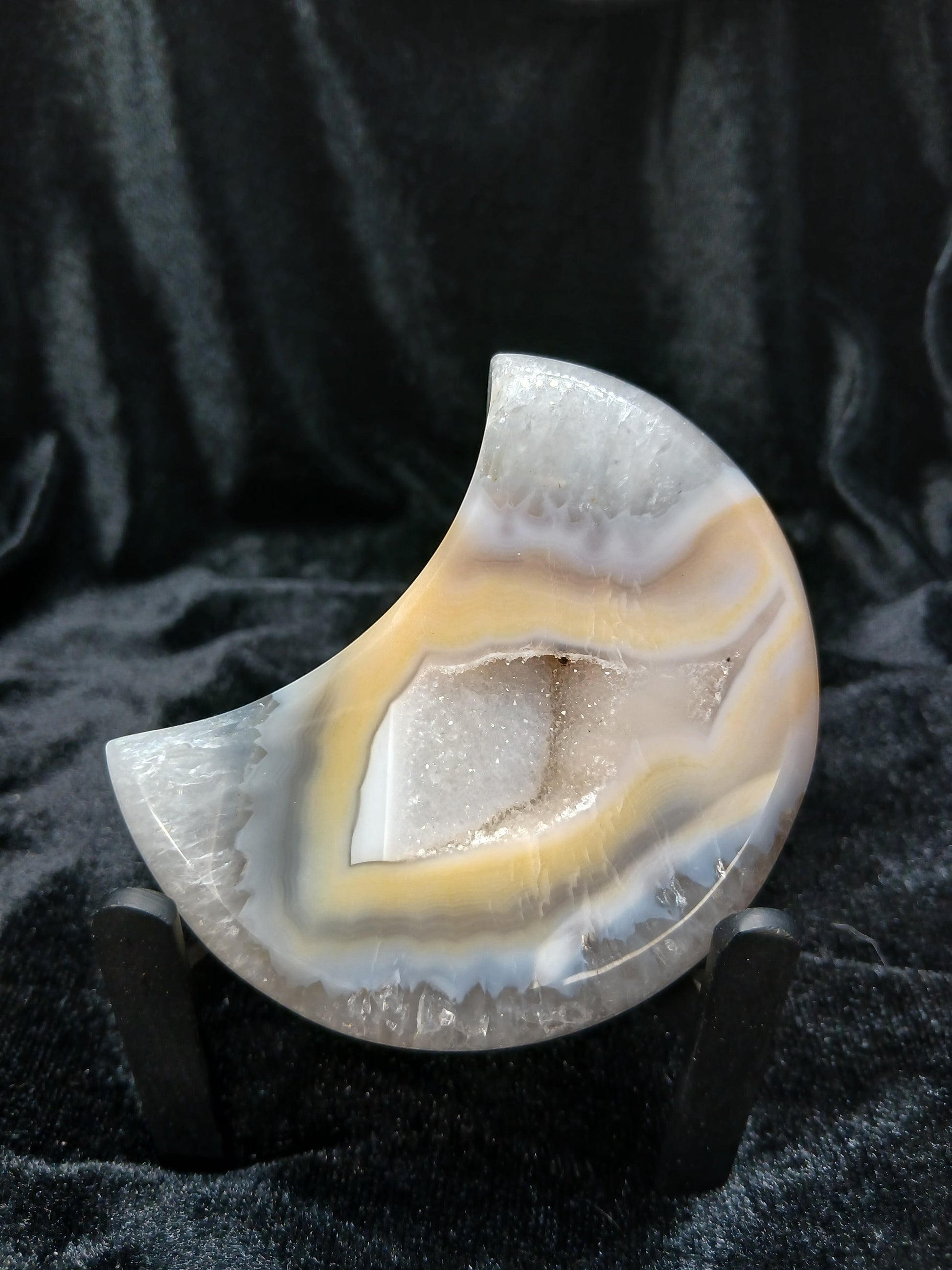 Fordite Haus: Crystals & Fordite peach and cream agate crescent moon carving with a central druzy geode pocket