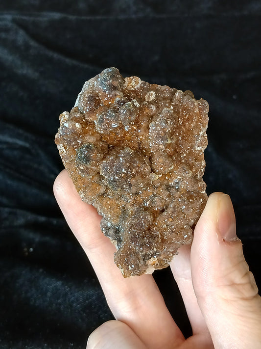 Fordite Haus: Crystals & Fordite peachy manganese druzy quartz mineral specimen with sparkly texture held in hand