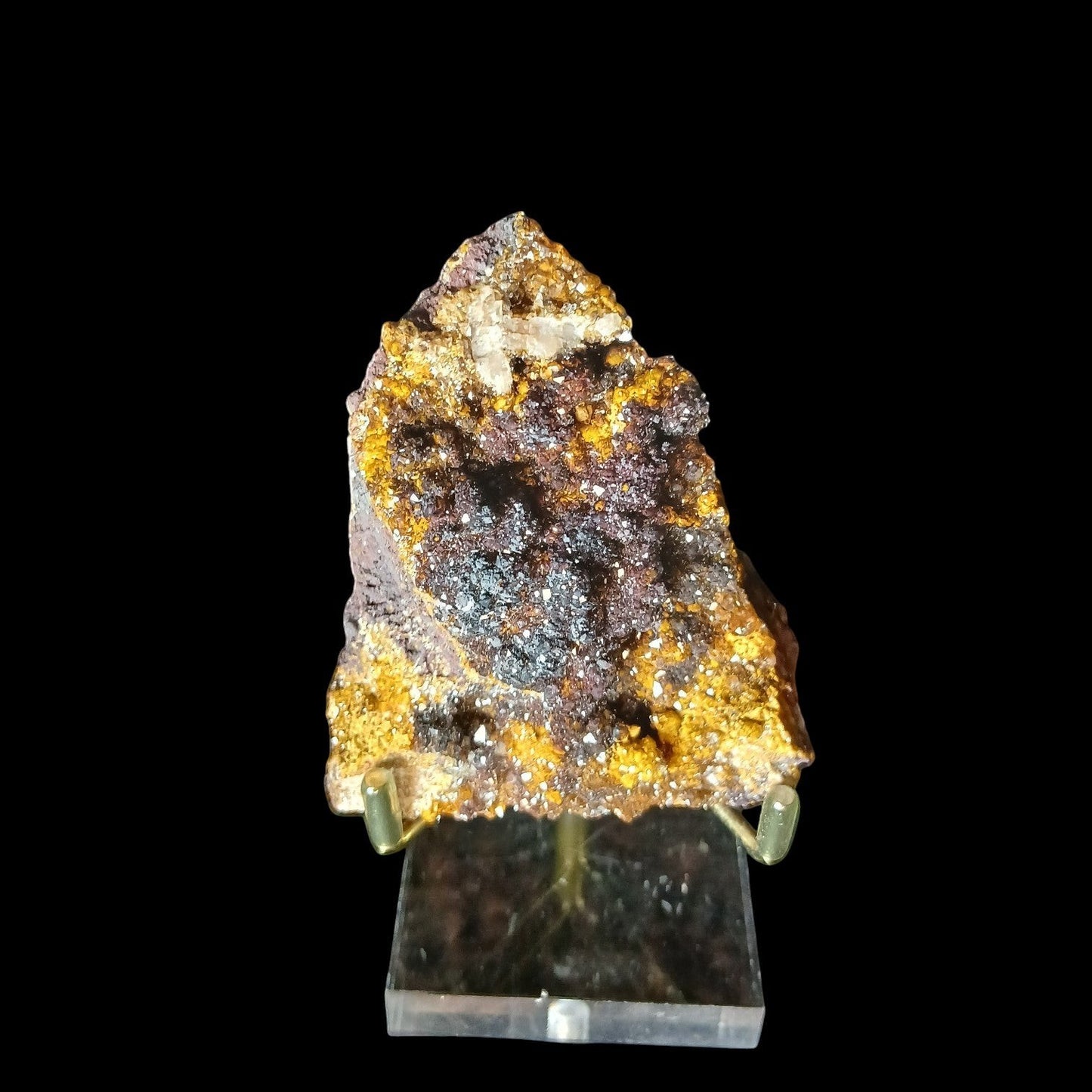 Fordite Haus: Crystals & Fordite tri-color manganese druzy quartz mineral specimen with sparkly texture on a stand.