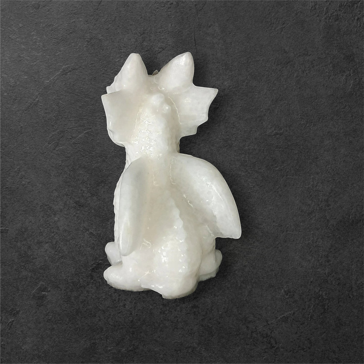Fordite Haus: Crystals & Fordite 3.25-inch white jade dragon carving with smooth, polished natural stone finish.