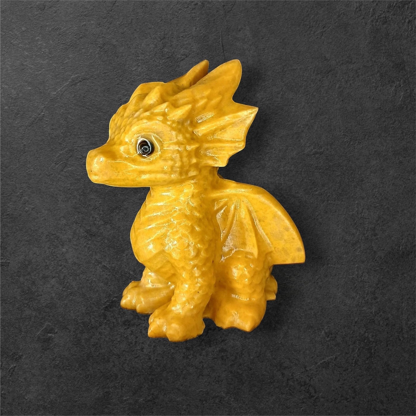 Fordite Haus: Crystals & Fordite yellow jasper dragon carving with polished smooth finish and detailed scales.