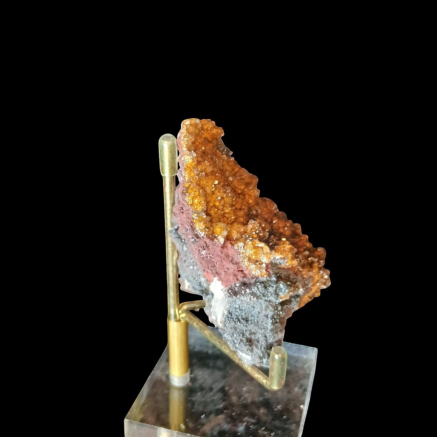 Fordite Haus: Crystals & Fordite yellow manganese druzy quartz mineral specimen on a gold display stand.