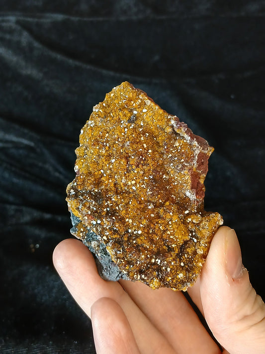 Fordite Haus: Crystals & Fordite yellow manganese druzy quartz mineral specimen with sparkly texture held in hand